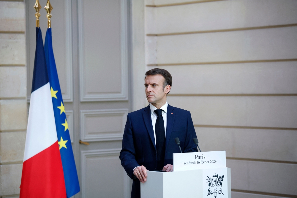 French President Emmanuel Macron speaks during a joint statement with Jordan's king at the Elysee Palace in Paris, on February 16, 2024. (Photo by Yoan VALAT / POOL / AFP)
