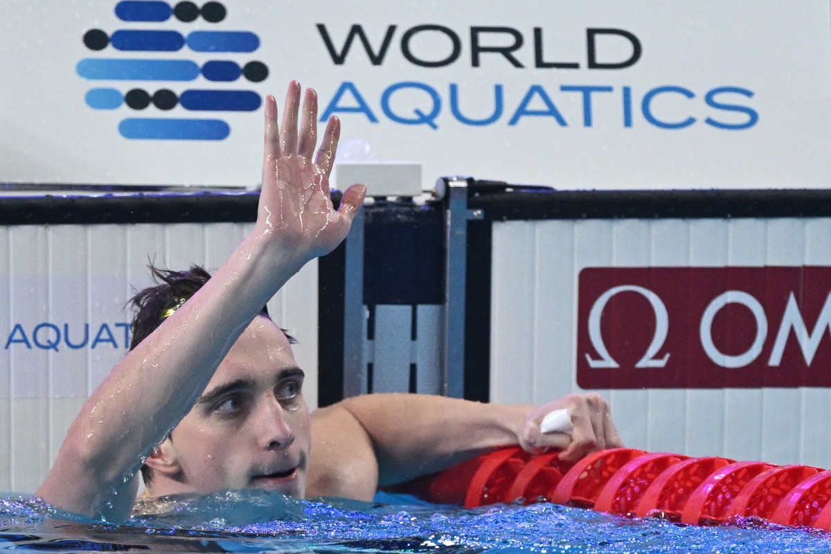 Ukraine’s Vladyslav Bukhov reacts after winning the men’s 50m freestyle swimming final. AFP