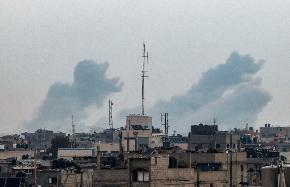 Smoke billowing over Khan Yunis in the southern Gaza Strip during Israeli bombardment on February 20, 2024. (Photo by Mohammed Abed / AFP)
 