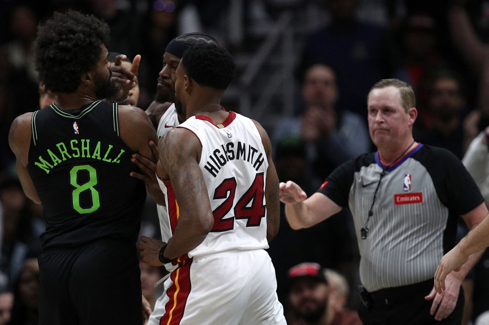 Naji Marshall #8 of the New Orleans Pelicans and Jimmy Butler #22 of the Miami Heat are involved in an altercation during the fourth quarter of an NBA game at Smoothie King Center on February 23, 2024 in New Orleans, Louisiana. (Photo by Sean Gardner / GETTY IMAGES NORTH AMERICA / Getty Images via AFP)
