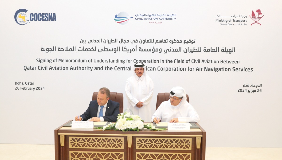 Minister of Transport H E Jassim Saif Ahmed Al Sulaiti looks on as In charge of managing QCAA Mohammed Faleh Alhajri, Executive Director and CEO of COCESNA  Juan Carlos Trabanino sign MoU.