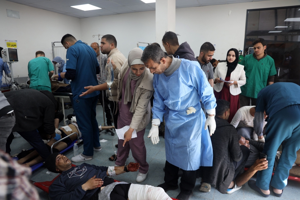 People receive medical attention at the Kuwaiti hospital for wounds sustained in an Israeli bombardment that hit a camp sheltering displaced Palestinians near the Emirati hospital, in Rafah in the southern Gaza Strip on March 2, 2024, amid the ongoing conflict between Israel and the Hamas movement. (Photo by AFP)
