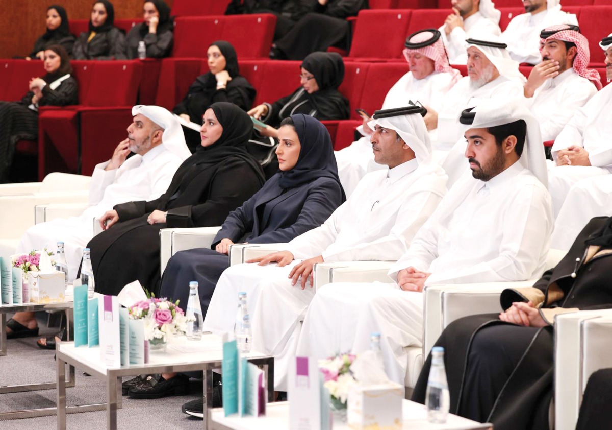 Assistant Undersecretary for Family Affairs at MoSDF Sheikha Sheikha bint Jassim Al Thani (centre); Assistant Undersecretary for Educational Affairs at MoEHE, Maha Al Ruwaili (second left); Executive Director of AMAN Centre Sheikh Dr. Nasser bin Ahmed Al Thani (second right); and other officials at the event held at Qatar University yesterday.