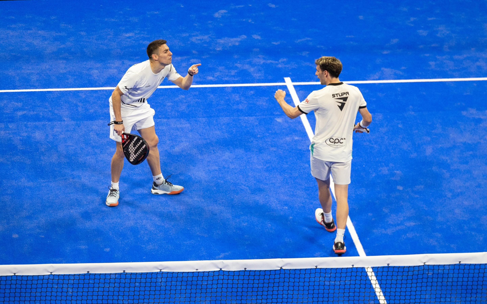 Argentina's Franco Stupaczuk (right) and Martin Di Nenno celebrate after scoring a point against Momo Gonzalez and Federico Chingotto.