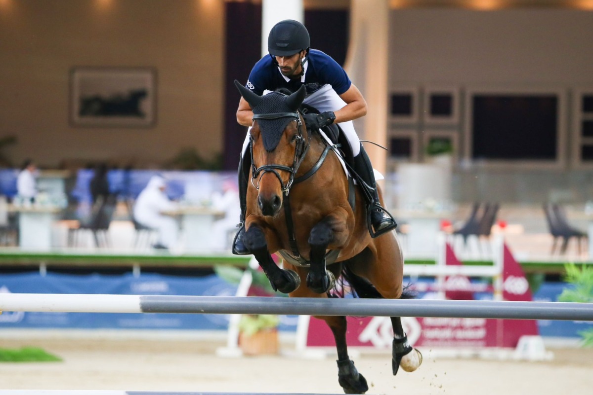 Rashid Towaim Al Marri guides Navaronne over a fence in this file photo.