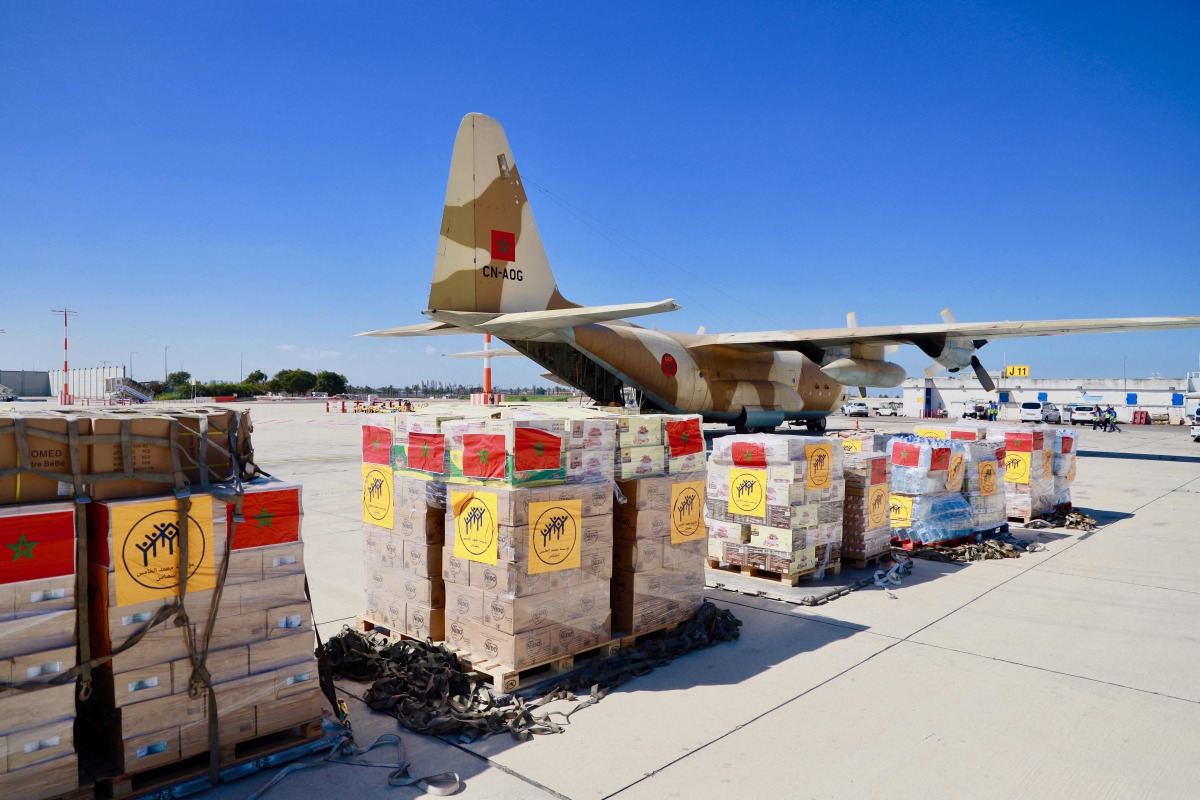 This handout picture taken on March 11, 2024 by the Maghreb Arabe Presse shows humanitarian aid shipped from Morocco to the people in gaza being handled at the Israeli Ben Guiron Airport in Tel Aviv. (Photo by Maghreb Arabe Presse / AFP) 