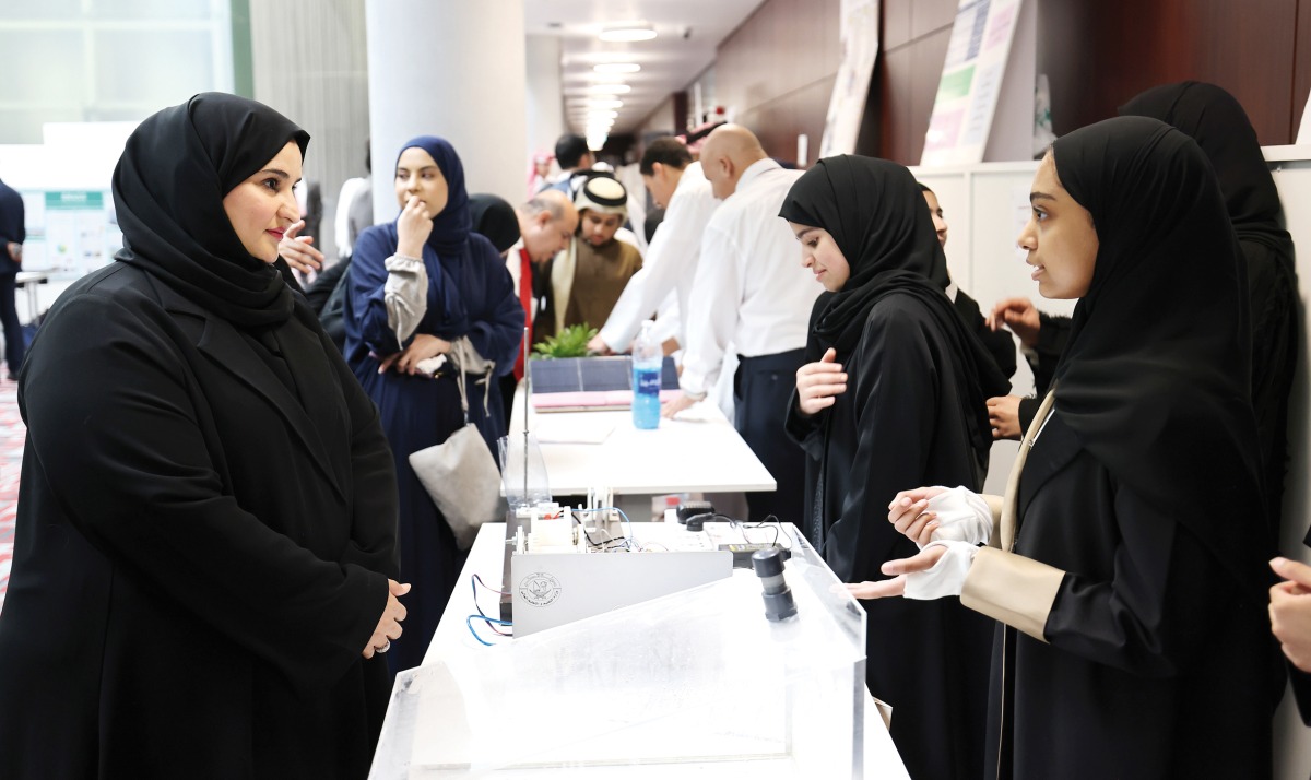 Assistant Undersecretary for Educational Affairs Maha Zayed Al Ruwaili (left) interacting with an exhibitor at the event.