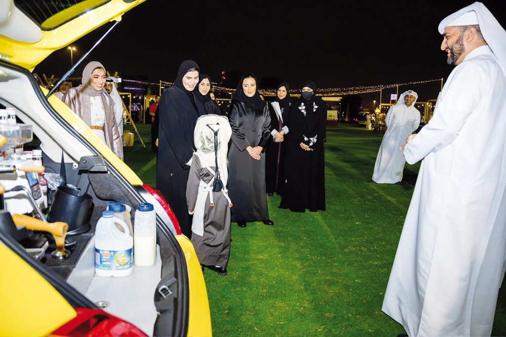 Minister of Social Development and Family H E Maryam bint Ali bin Nasser Al Misnad with other officials and participants during the exhibition.