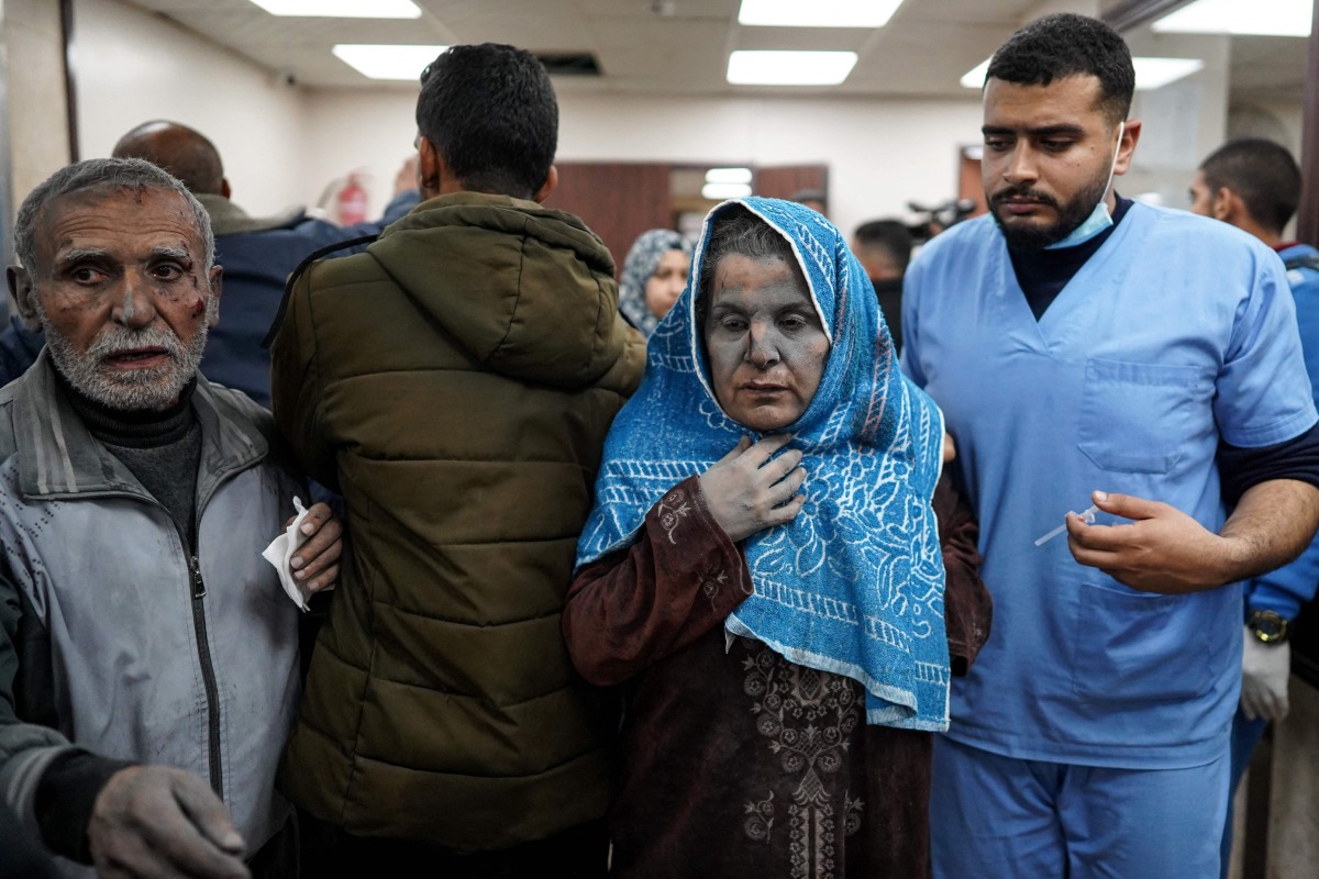 Wounded Palestinians arrive at the Al-Aqsa Martyrs Hospital in Deir al-Balah on March 19, 2024, following Israeli bombardment in the Nuseirat refugee camp in the central gaza Strip. (Photo by AFP)
