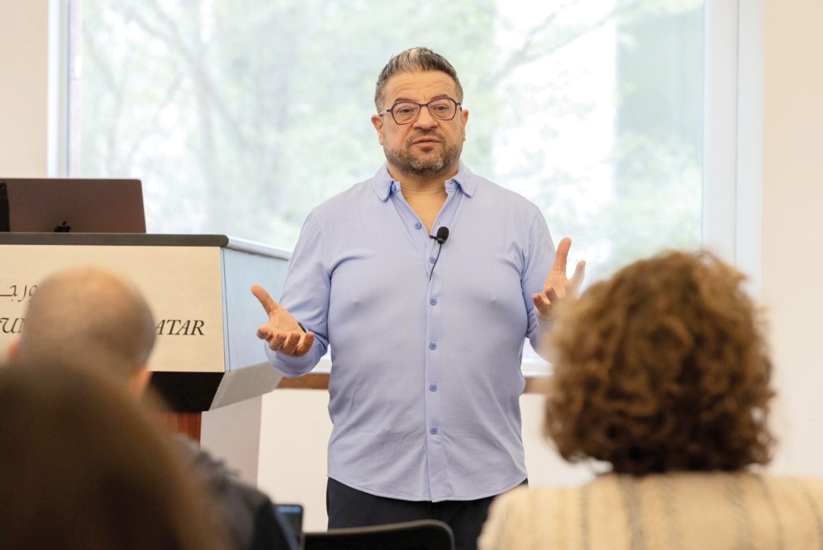 Dr. Bassam Haddad (centre) during his presentation.