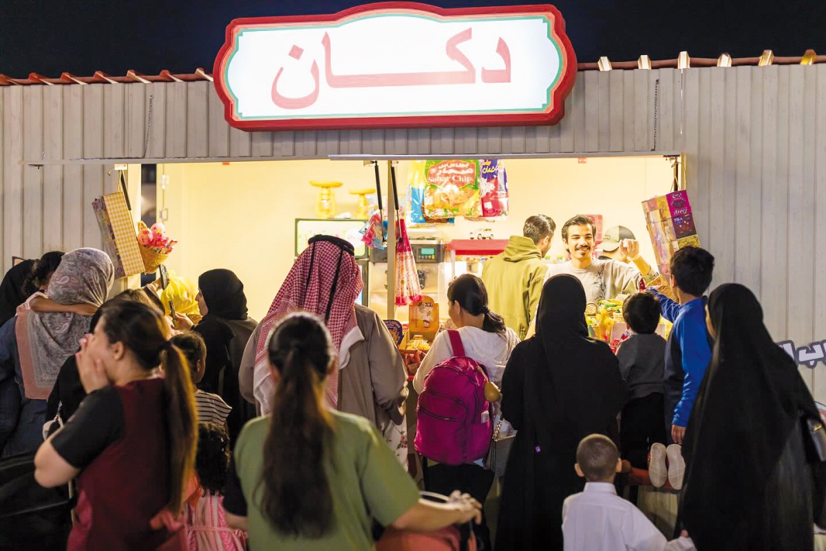 People gather at a shop during the Throwback Food Festival.