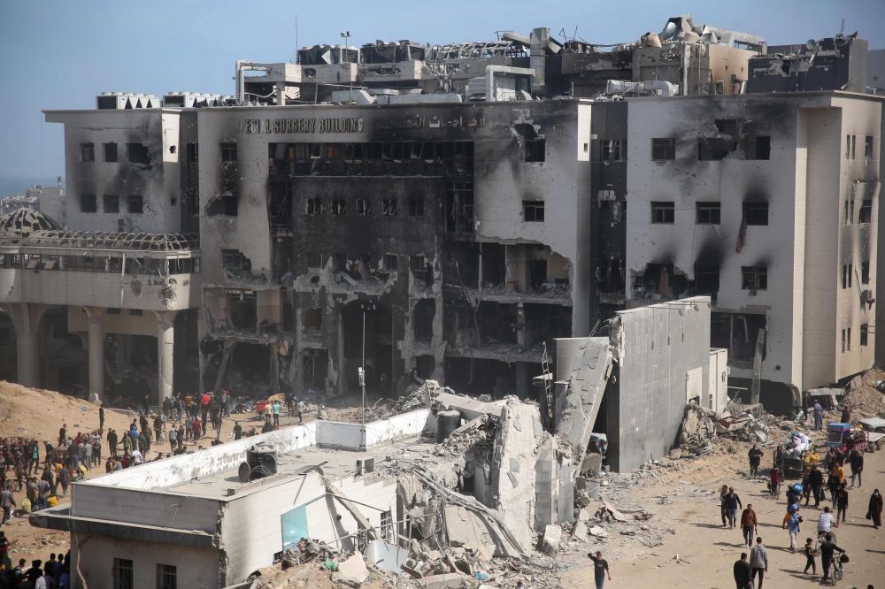 Palestinians inspect the damage at Gaza's Al-Shifa hospital after the Israeli military withdrew from the complex housing the hospital on April 1, 2024. (Photo by AFP)
 