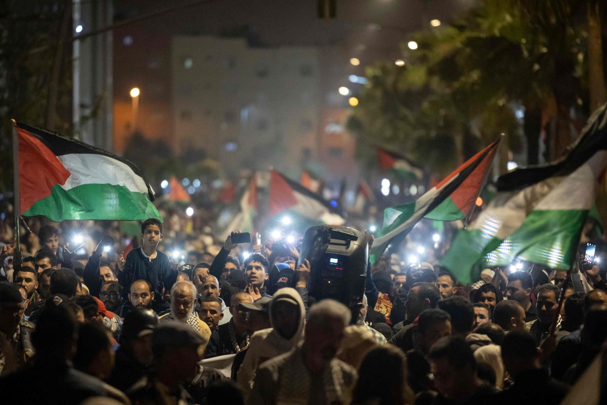 Moroccan protesters take part in a demonstration in solidarity with Palestinians following Al-Quds (Jerusalem) Day, a commemoration in support of Palestinian people on the last Friday of the holy month of Ramadan, in the city of Casablanca early on April 6, 2024. (Photo by FADEL SENNA / AFP)
