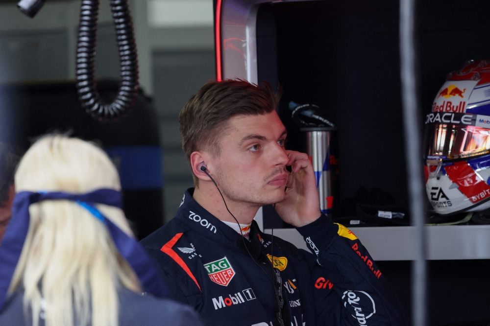 Red Bull Racing's Dutch driver Max Verstappen looks on from the pit before the qualifying session for the Formula One Japanese Grand Prix race at the Suzuka circuit in Suzuka, Mie prefecture on April 6, 2024. (Photo by Kim Kyung-Hoon / Pool / AFP)