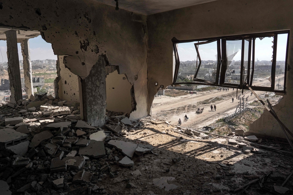 This picture taken on April 7, 2024 shows a view from atop a heavily damaged building of a street in Khan Yunis. (Photo by AFP)
