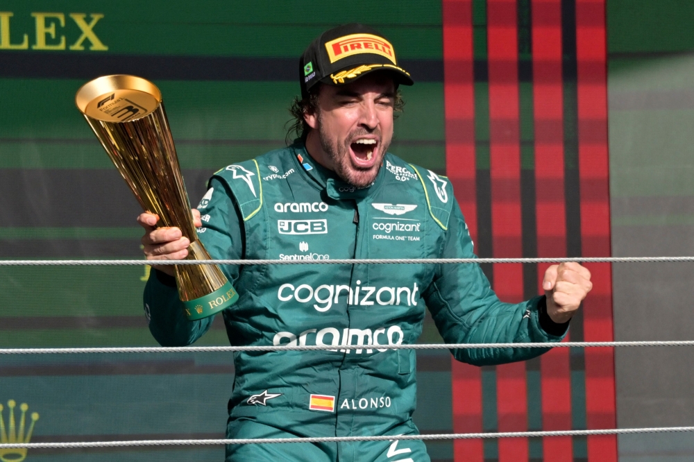 Third place Aston Martin's Spanish driver Fernando Alonso celebrates on the podium after the Formula One Brazil Grand Prix at the Autodromo Jose Carlos Pace racetrack, also known as Interlagos, in Sao Paulo, Brazil, on November 5, 2023. Photo by NELSON ALMEIDA / AFP