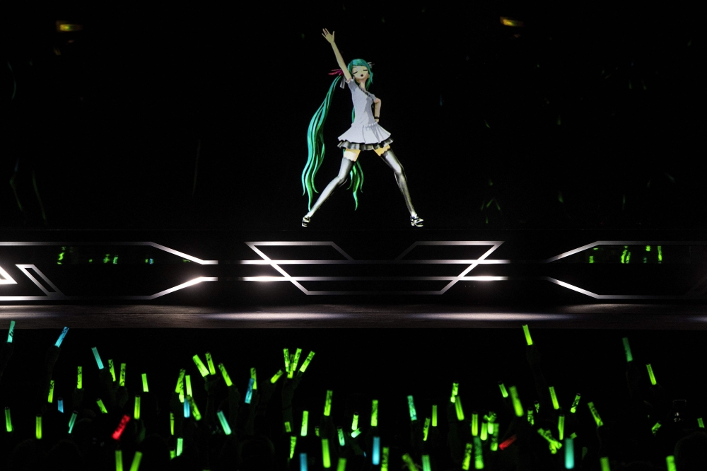 Japanese virtual singer Hatsune Miku performs on stage during a concert at the Zenith concerthall, in Paris, on January 16, 2020. Photo by Christophe ARCHAMBAULT / AFP