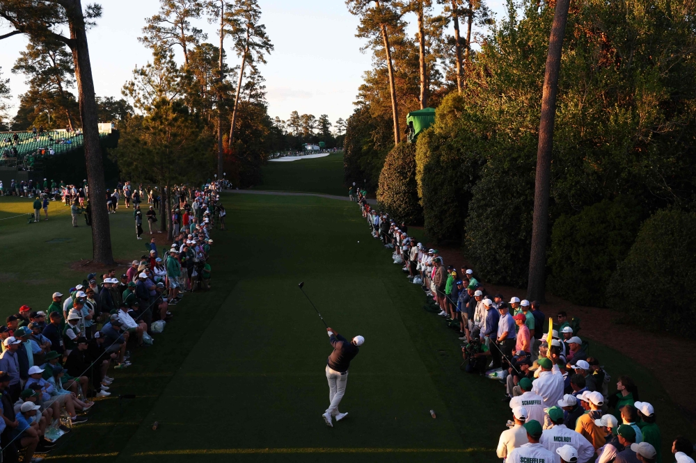 Scottie Scheffler of the United States plays his shot from the 18th tee during the second round of the 2024 Masters Tournament at Augusta National Golf Club on April 12, 2024 in Augusta, Georgia. (Photo by Andrew Redington / GETTY IMAGES NORTH AMERICA / Getty Images via AFP)
