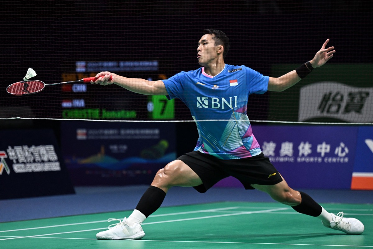 Indonesia's Jonatan Christie hits a return to China's Shi Yuqi during their men's singles semi-final match at the Badminton Asia Championships in Ningbo, in eastern China's Zhejiang province on April 13, 2024. (Photo by AFP)