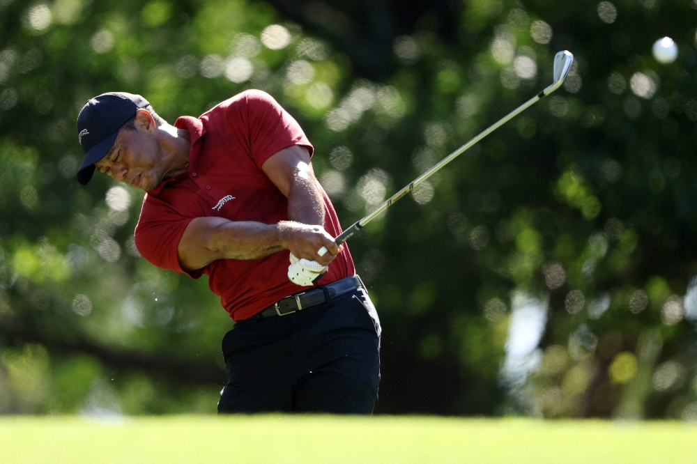 Tiger Woods of the United States plays his shot from the fourth tee during the final round of the 2024 Masters Tournament at Augusta National Golf Club on April 14, 2024 in Augusta, Georgia. (Photo by Warren Little / GETTY IMAGES NORTH AMERICA / Getty Images via AFP)
