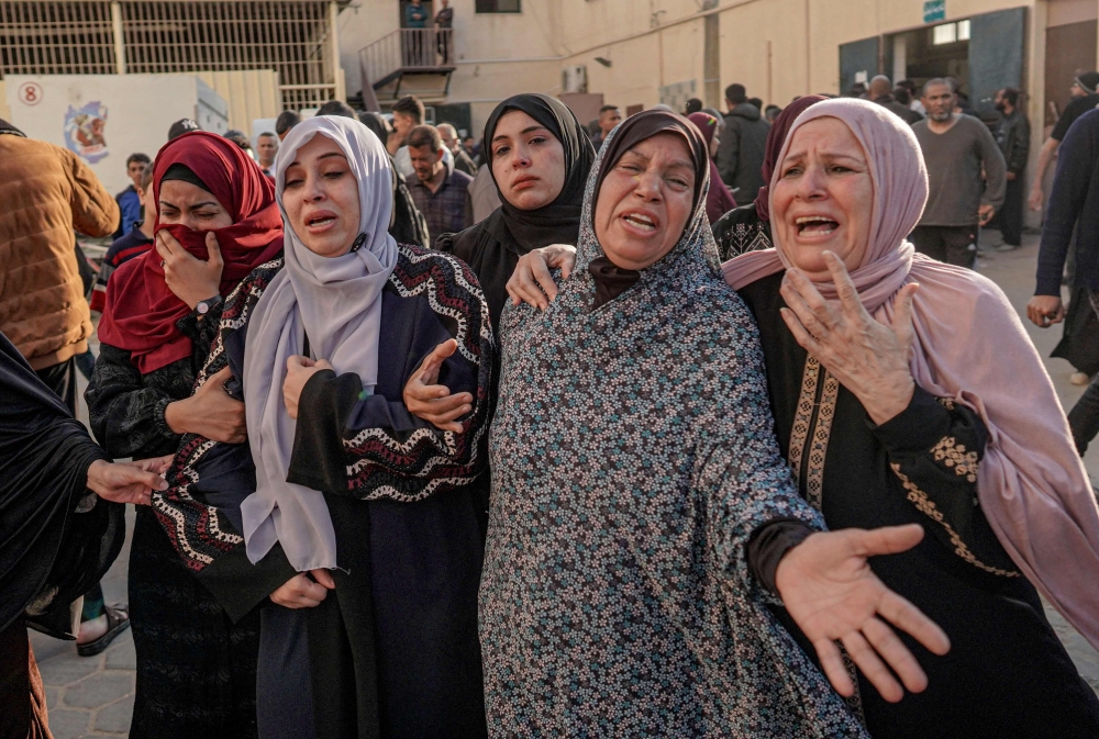 Palestinians mourn the death of loved ones following Israeli bombardment in Maghazi in the central Gaza Strip, on April 16, 2024. (Photo by AFP)