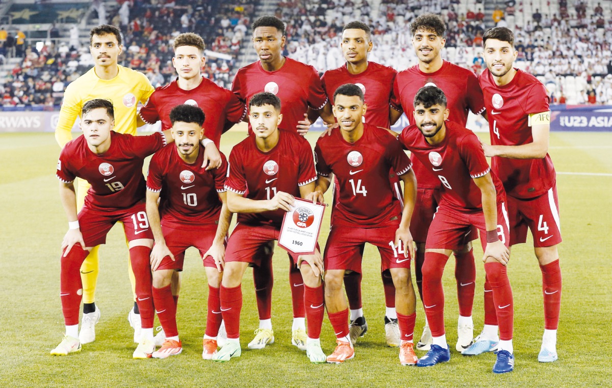 Qatar U23 players pose ahead of the opening match against Indonesia. 