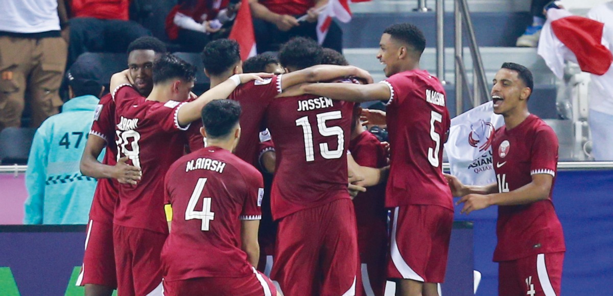 Qatar players celebrate a goal against Indonesia on Monday. 