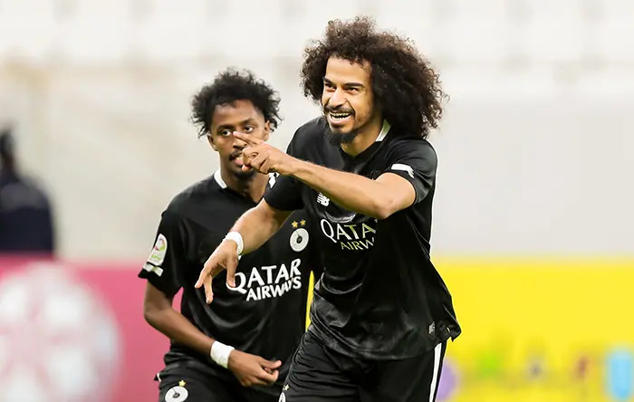 Al Sadd’s Akram Afif (right) celebrates with Yousuf Abdurisag. 