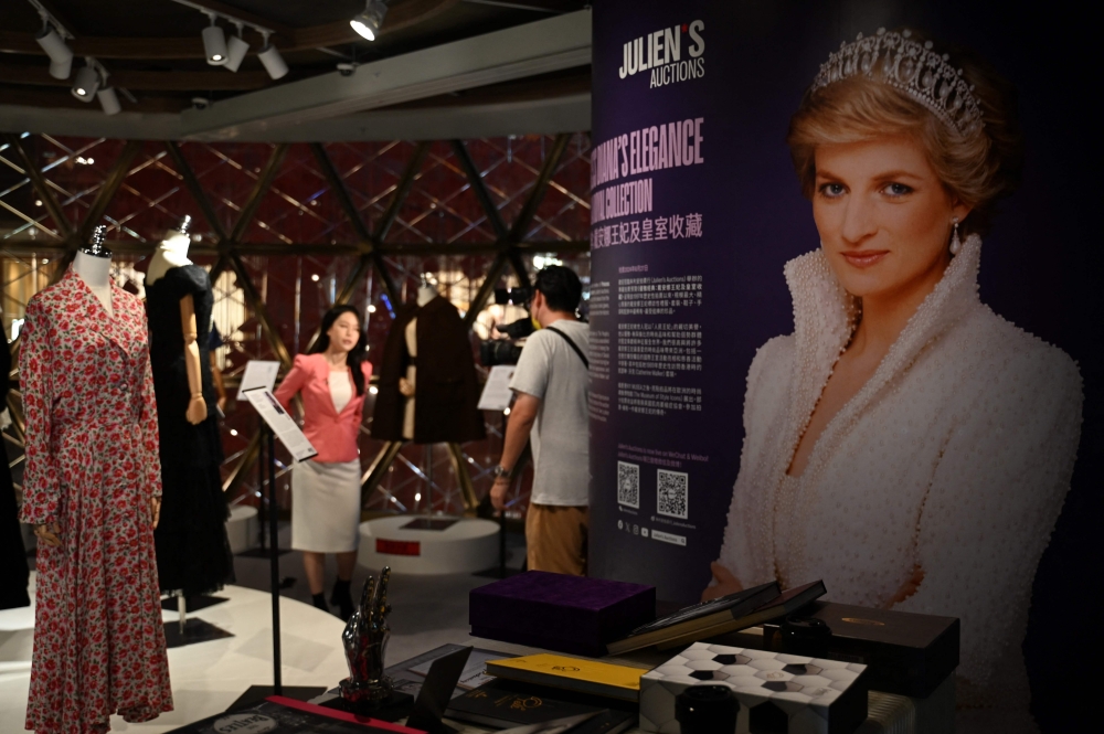 Photo taken on April 17, 2024 shows outfits once worn by Princess Diana at a media preview ahead of the auction by Julian’s Auctions on display in Hong Kong. (Photo by Peter Parks / AFP)