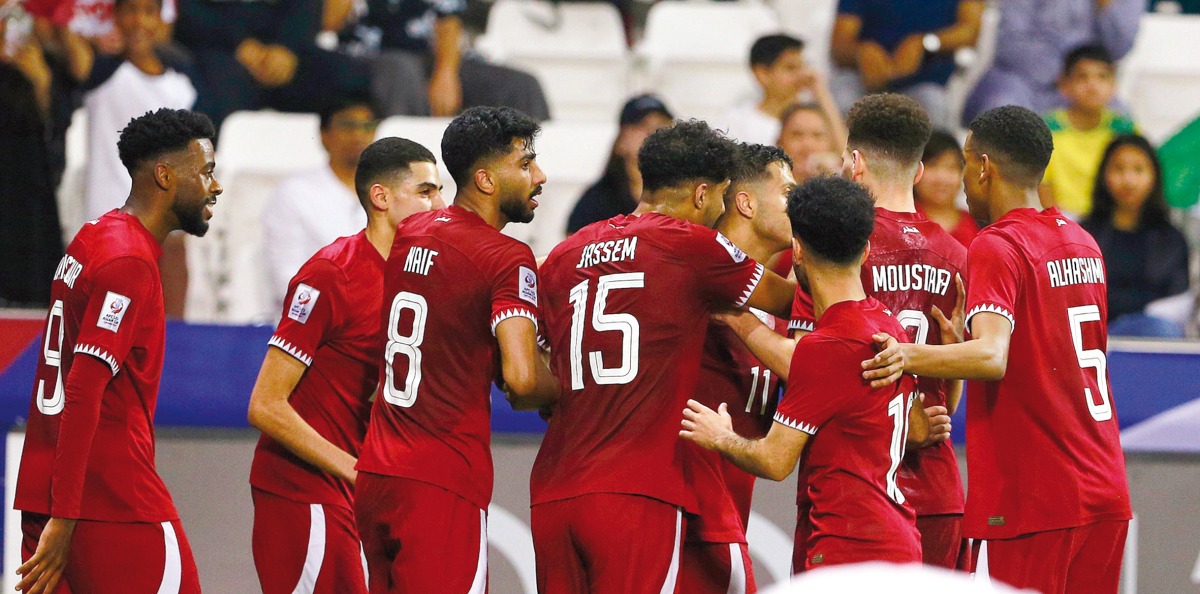 Qatar players celebrate a goal against Jordan on Thursday. 