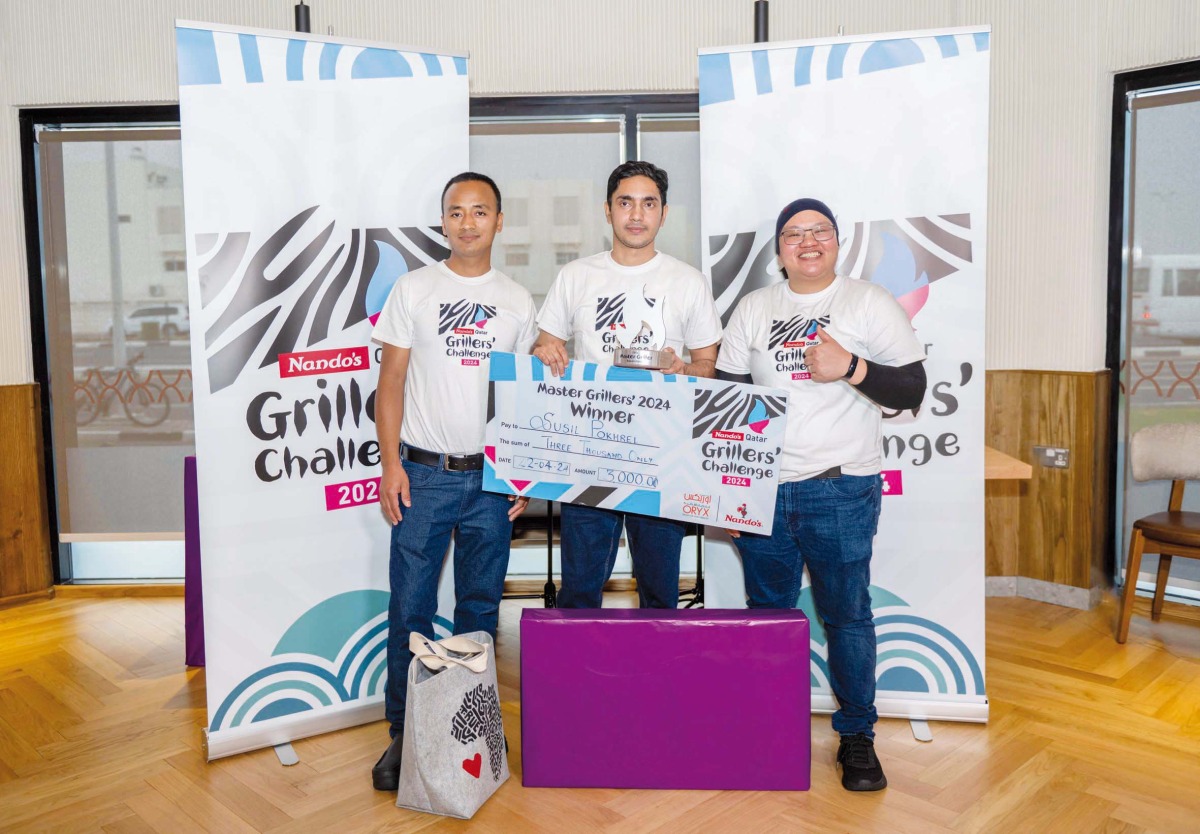 Nando’s Qatar 2024 Master Griller winner Susil Pokhrel with 1st runner-up Bishnu Gurung and 2nd runner-up Jean Pararillaga.