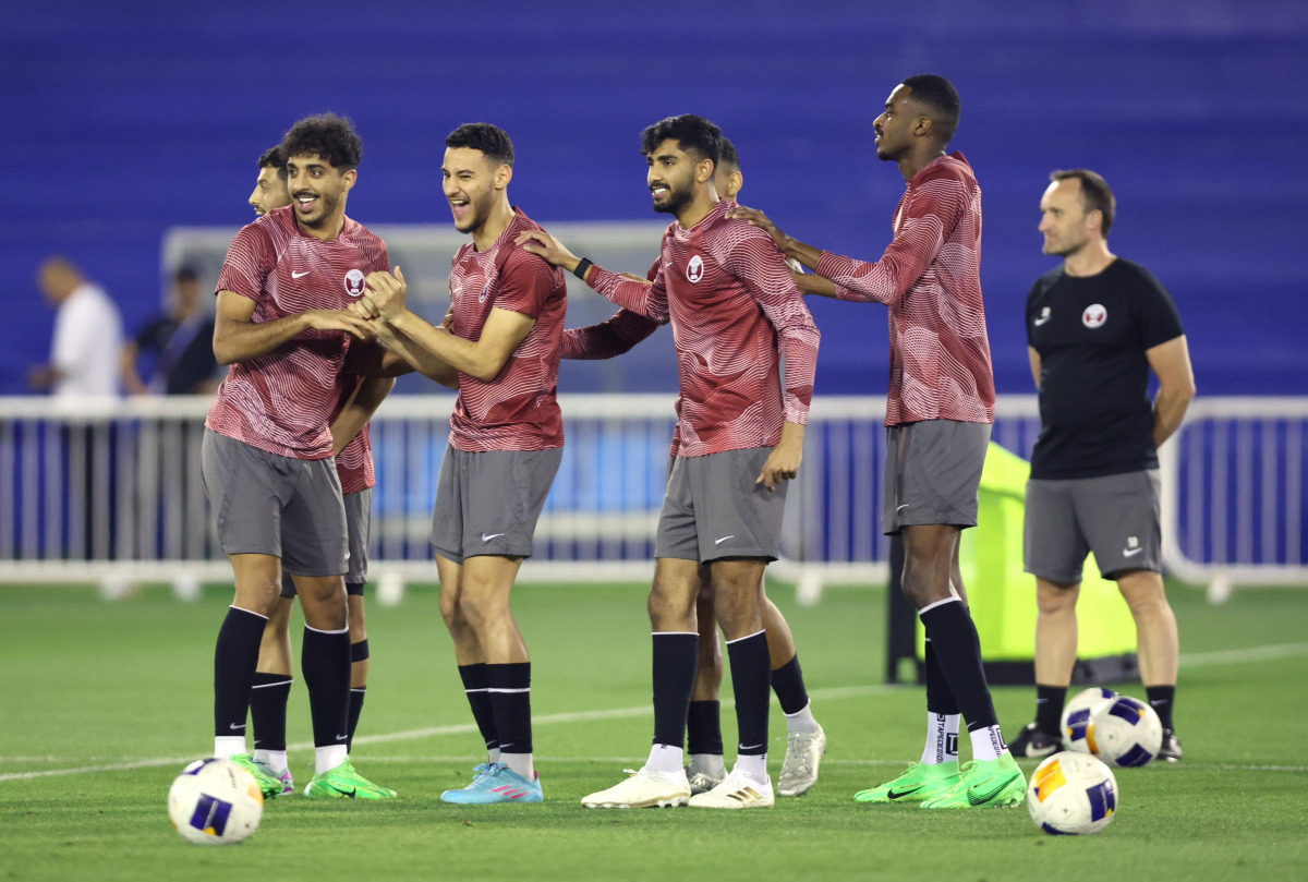 Qatar players share a light moment during team’s training session ahead of the quarter-final.