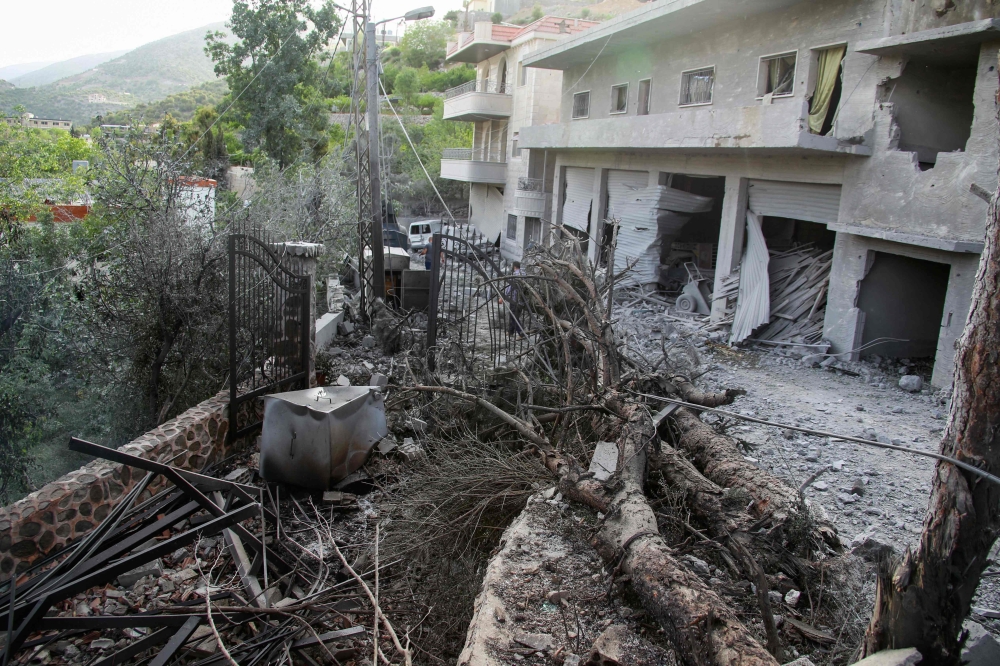 Rubble litters the area around a house which was hit overnight by an Israeli airstrike in the southern Lebanese village of Shebaa near the border on April 26, 2024. (Photo by Rabih Daher / AFP)