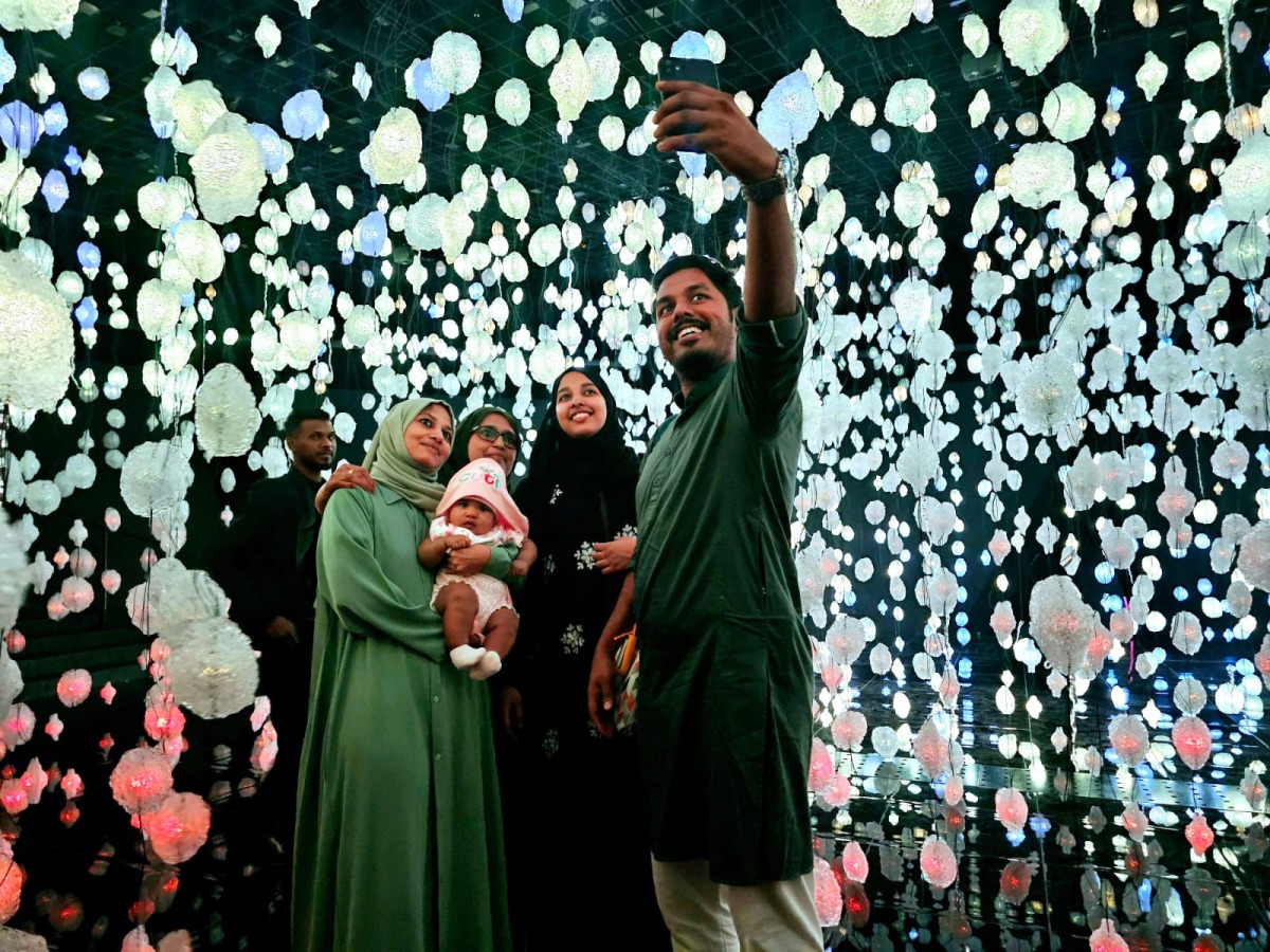 Wajeeha Latheef and family pose for a picture after exploring 'Your Brain to Me, My Brain to You' exhibition at NMOQ on April 26, 2024. Pic: Marivie Alabanza / The Peninsula