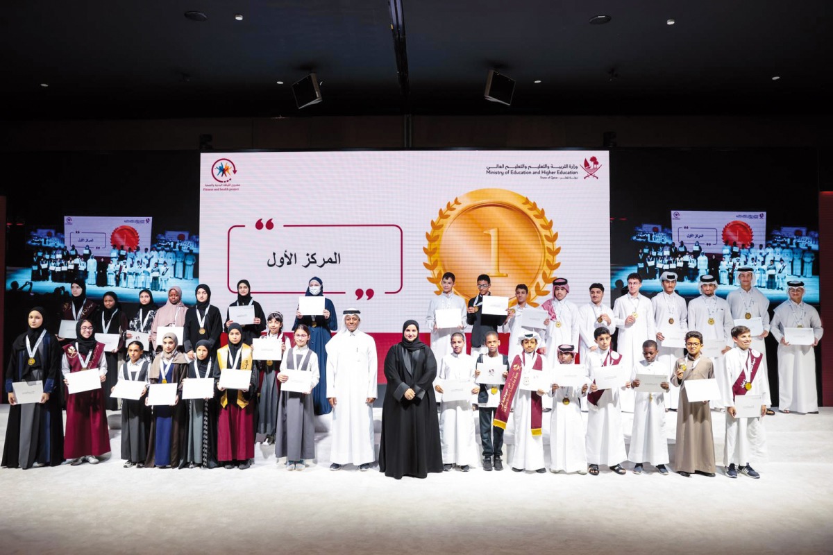 Assistant Undersecretary for Educational Affairs at MoEHE Maha Zaid Al Ruwaili (front, centre) with winners of second fitness and health project in a ceremony yesterday.