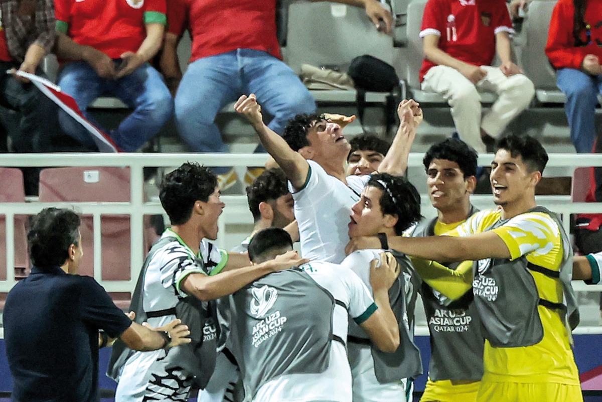 Iraq’s Ali Jasim celebrates with teammates after scoring his team’s second goal against Indonesia at Abdullah Bin Khalifa Stadium in Doha, yesterday. PICS: AFP