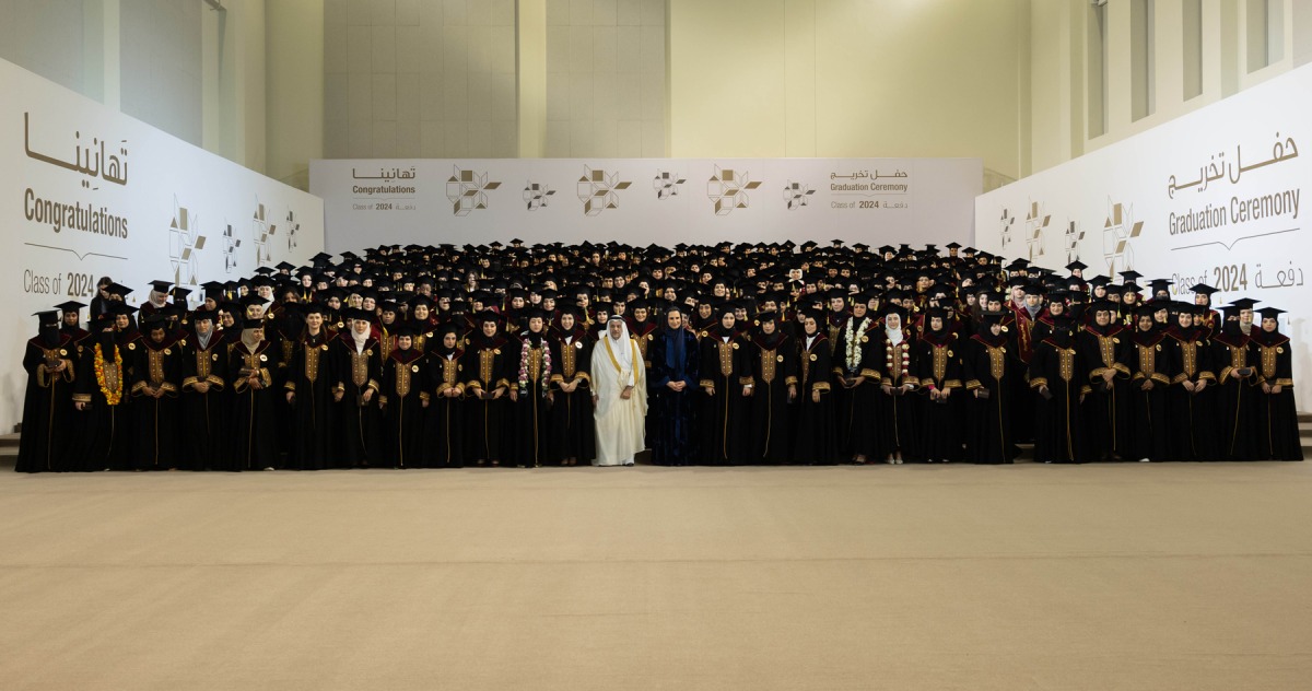 Her Highness Consort of HH The Amir Sheikha Jawaher bint Hamad bin Suhaim Al Thani and QU President Dr. Omar Al-Ansari in a group photo with the distinguished female Class of 2024 graduates.