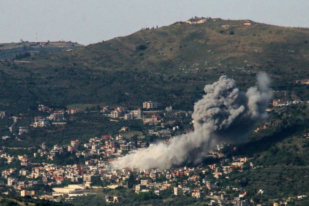 Smoke billows over the southern Lebanese village of Kfar Kila following Israeli bombardment on May 10, 2024. (Photo by Rabih DAHER / AFP)
