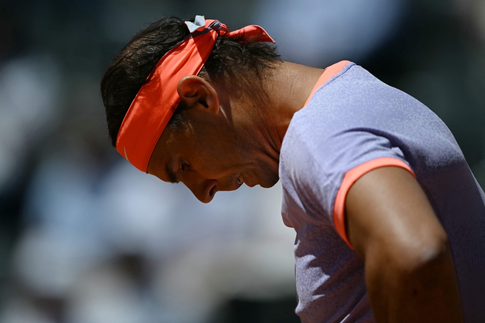 Spain's Rafael Nadal reacts during his match against Poland's Hubert Hurkacz during the Men's ATP Rome Open tennis tournament at Foro Italico in Rome on May 11, 2024. (Photo by Filippo Monteforte / AFP)
 