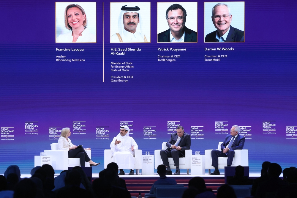 Minister of State for Energy Affairs, President and CEO of QatarEnergy H E Saad Sherida Al Kaabi (2nd left), Chairman and CEO of TotalEnergies Patrick Pouyanné (3rd left), and Chairman and CEO of ExxonMobil Darren Woods (right), attend a session at the Qatar Economic Forum in Doha on May 15, 2024. (Photo by Karim Jaafar / AFP)