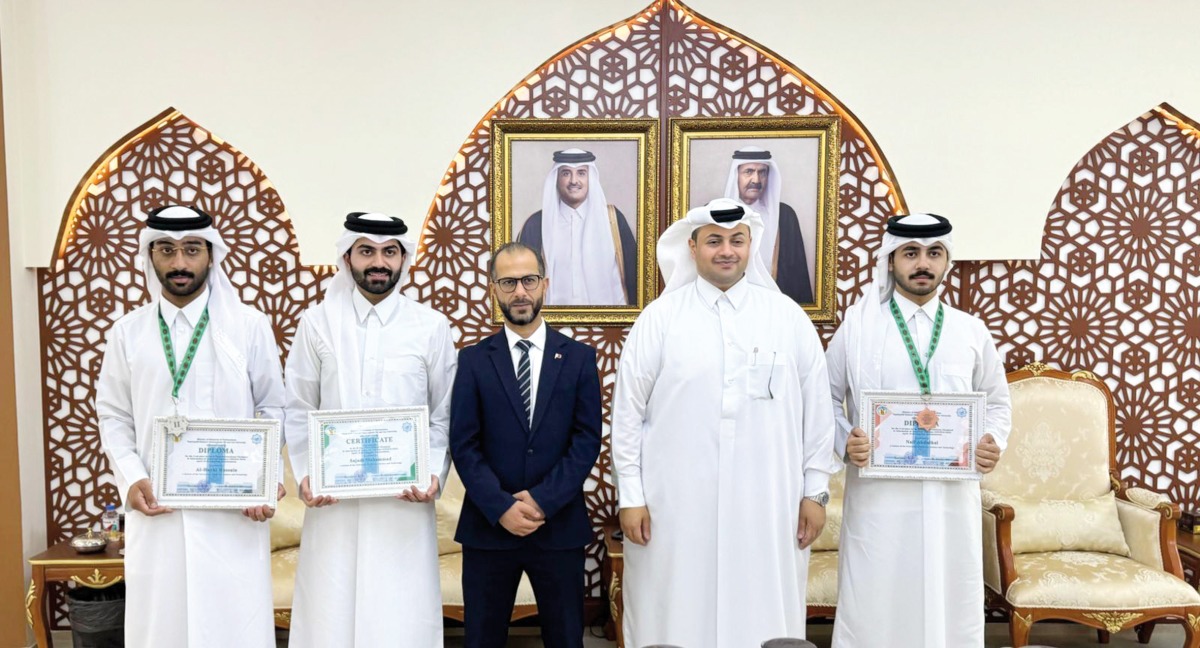 UDST students with certificates who won during the competition