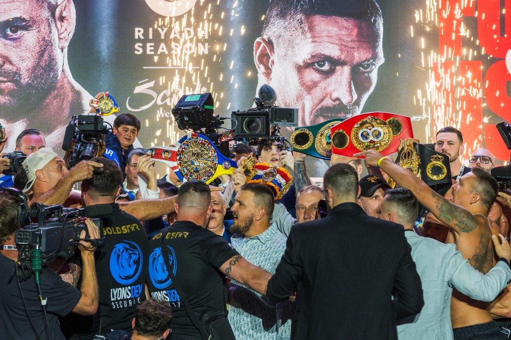 Britain's Tyson Fury (left) and Ukraine's Oleksandr Usyk (right) face-off during the official weigh-in on the eve of their heavyweight world boxing championship fight in Riyadh on May 17, 2024. (Photo by Yasser al-Umari / AFP)