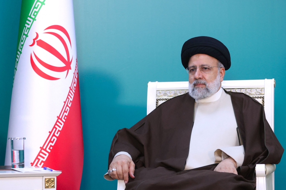 A handout picture provided by the Iranian presidency shows Iran's President Ebrahim Raisi during a meeting with his Azeri counterpart ahead of the inauguration ceremony of Qiz Qalasi, the third dam jointly built by Iran and Azerbaijan on the Aras River. Photo by Iranian Presidency / AFP