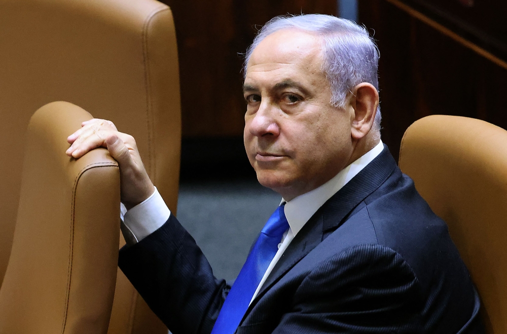 (Files) Israel's Prime Minister Benjamin Netanyahu attends a special session to vote on a new government at the Knesset in Jerusalem, on June 13, 2021. (Photo by Emmanuel Dunand / AFP)