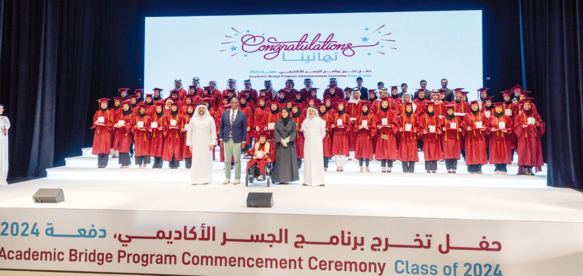 Officials with graduates during the ceremony.