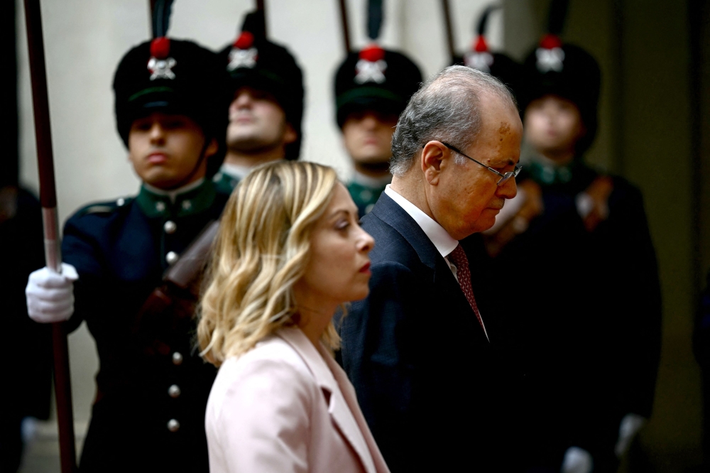 Italy's Prime Minister Giorgia Meloni (front) welcomes her Palestinian Authority counterpart Mohammed Mustafa prior to their meeting at Palazzo Chigi in Rome on May 25 2024. (Photo by Filippo Monteforte / AFP)