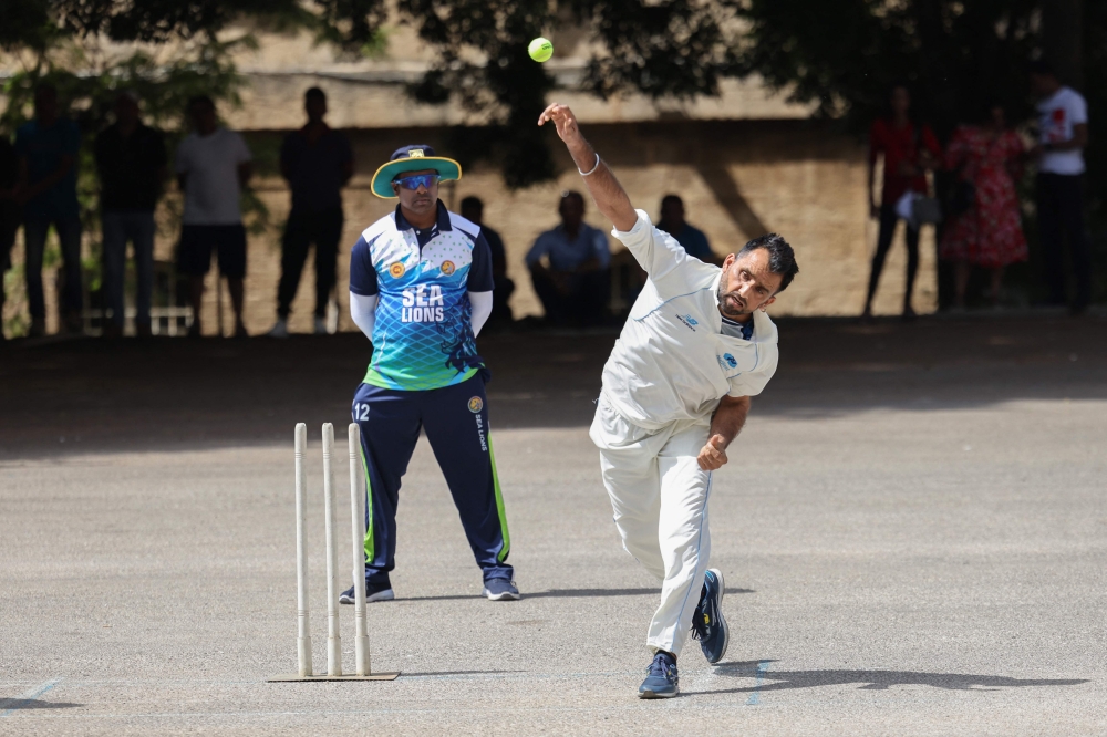 A player from Eleven Brothers migrants' team plays weekly in the Lebanese capital Beirut, on May 19, 2024. (Photo by Anwar Amro / AFP)