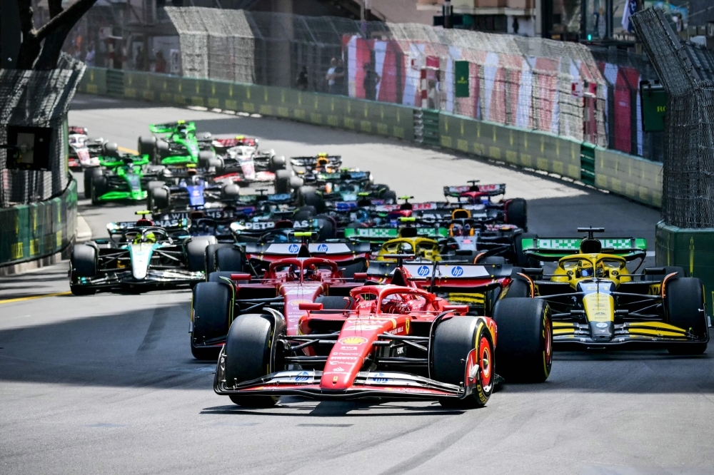 Ferrari's Monegasque driver Charles Leclerc leads at the start of the Formula One Monaco Grand Prix on May 26, 2024 at the Circuit de Monaco. (Photo by ANDREJ ISAKOVIC / AFP)