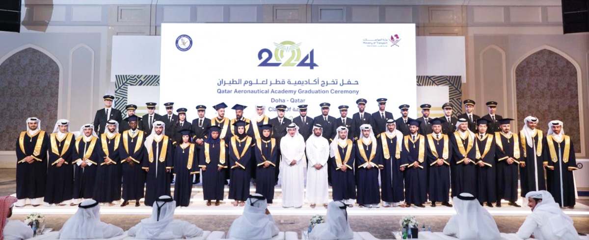 Minister of Transport H E Jassim Saif Ahmed Al Sulaiti with graduates at Qatar Aeronautical Academy graduation event. 