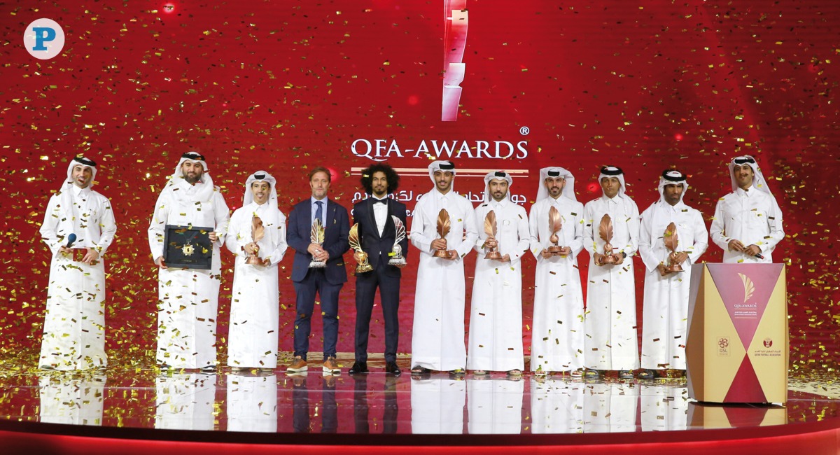 Minister of Sports and Youth H E Sheikh Hamad bin Khalifa bin Ahmed Al Thani receives the Order of Achievement Award from QFA President Jassim bin Rashid Al Buenain. PICTURES: RAJAN VADAKKEMURIYIL / The Peninsula